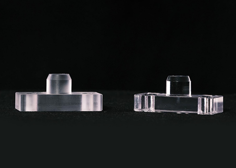 CNC Milled Acrylic Pivot Stops.  These part then get Vapor Polished, which is a chemical that hits the acrylic material, clears the 